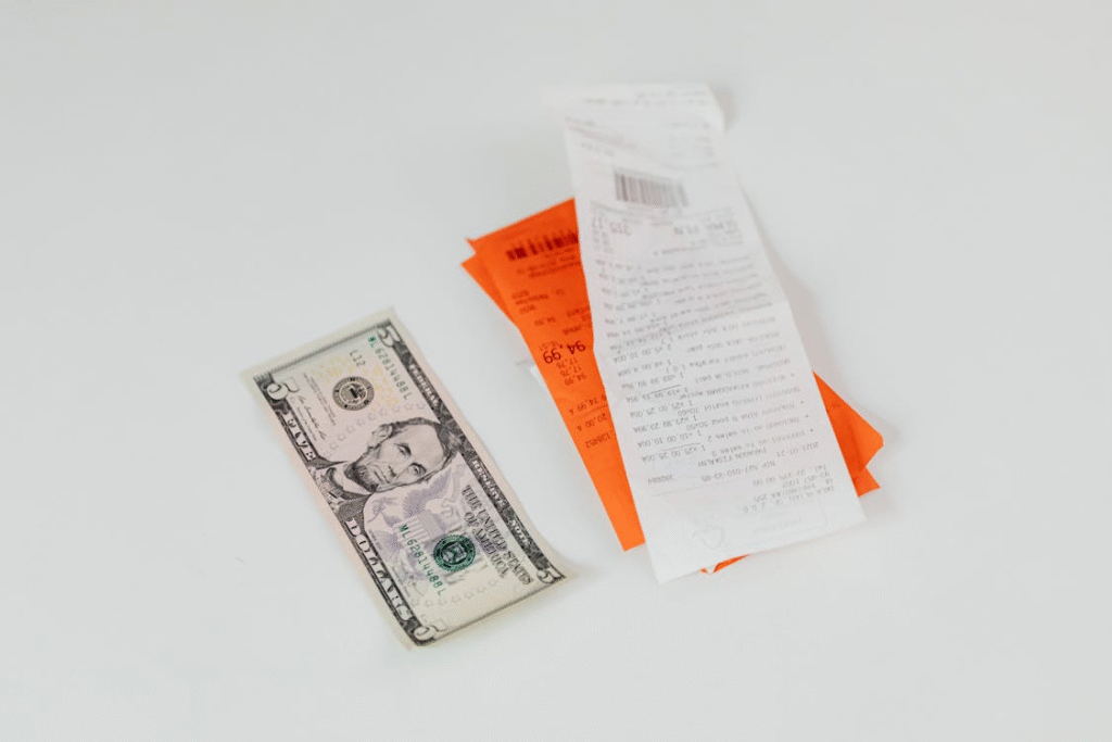 A grocery receipt showing rising prices, illustrating the urgent need for a strategy on how to beat inflation.